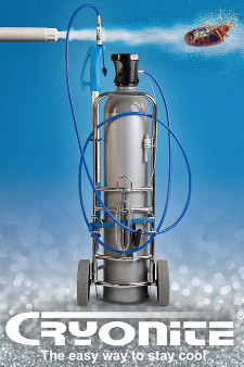 A silver oxygen tank sitting on top of a blue floor.